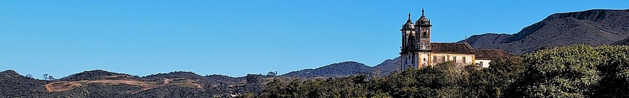 Banner principal do site: Minas Gerais: terra de montanhas, cachoeiras, lugares históricos, gastronomia única e a Estrada Real